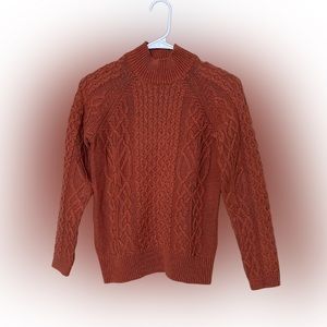 A sweater from PRESWICK MOORE.